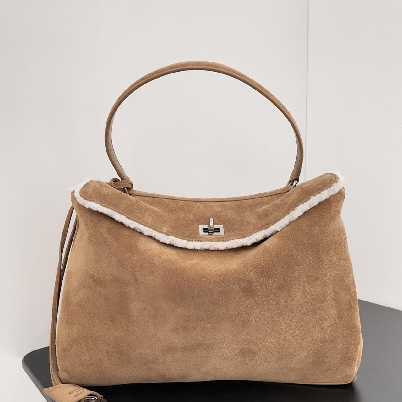 Camel suede top handle bag with shearling trim and silver turn-lock closure
